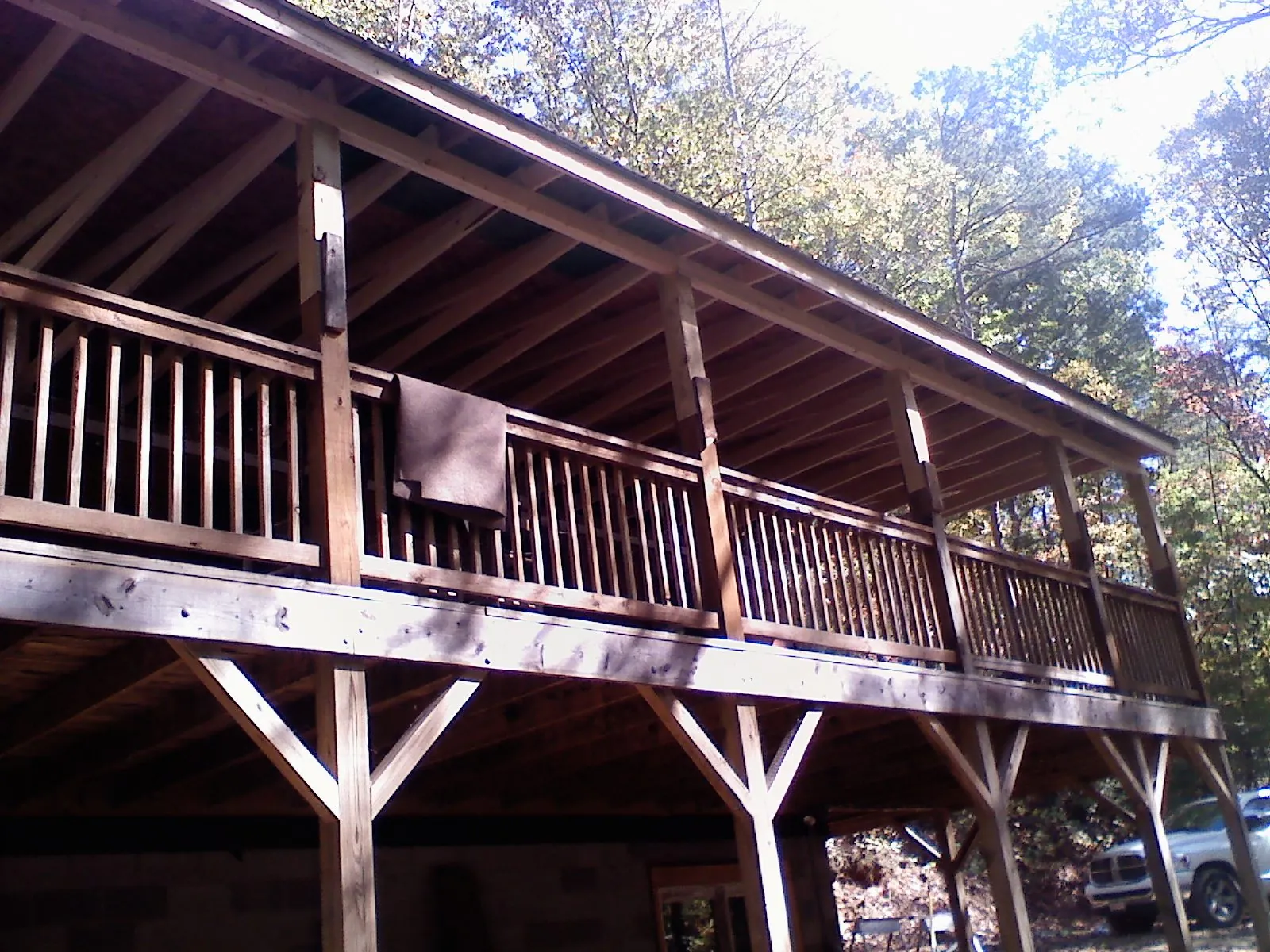 Timber framing under a new elevated porch and deck — Roof Leak Repair in Comfort by Roofing Brothers